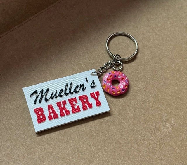Mueller's Sign Key Chains